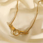 Golden hands necklace